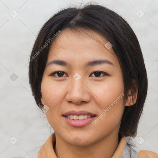 Joyful asian young-adult female with medium  brown hair and brown eyes