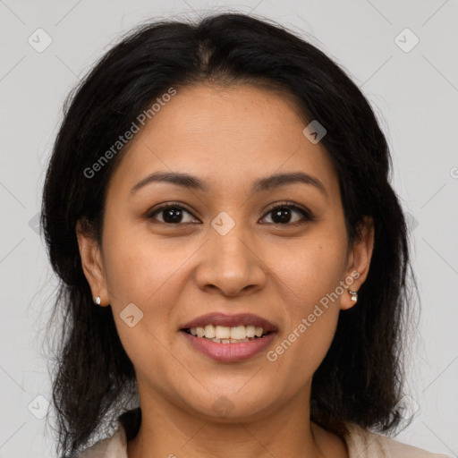 Joyful latino young-adult female with medium  brown hair and brown eyes