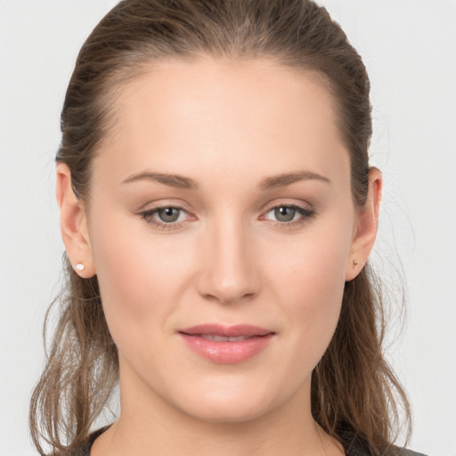 Joyful white young-adult female with long  brown hair and grey eyes