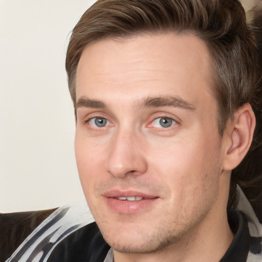 Joyful white adult male with short  brown hair and grey eyes