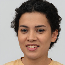 Joyful latino young-adult female with short  brown hair and brown eyes