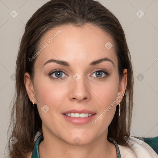 Joyful white young-adult female with long  brown hair and blue eyes