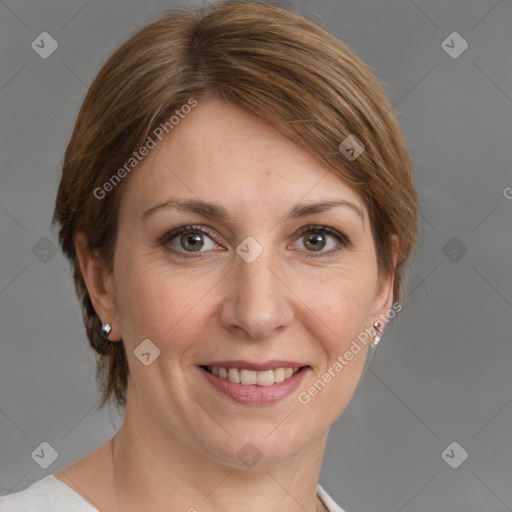 Joyful white adult female with medium  brown hair and grey eyes