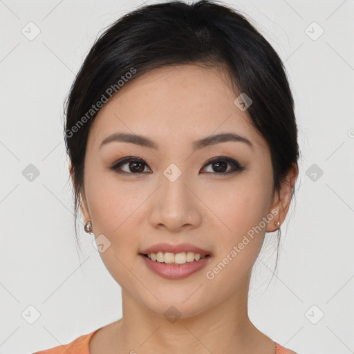 Joyful asian young-adult female with long  brown hair and brown eyes