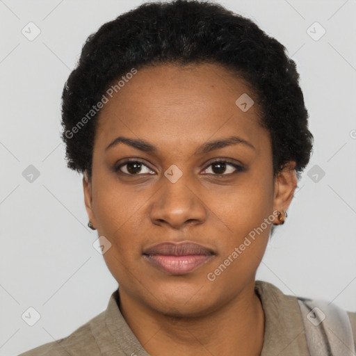 Joyful black young-adult female with short  black hair and brown eyes