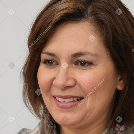 Joyful white adult female with medium  brown hair and brown eyes