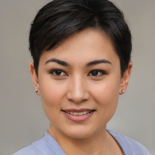Joyful asian young-adult female with short  brown hair and brown eyes