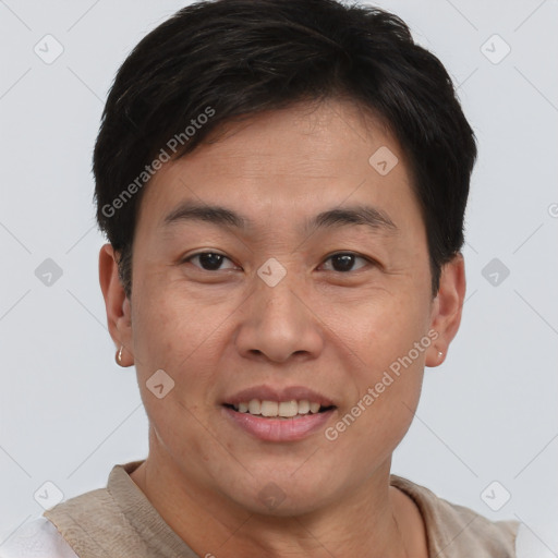 Joyful white adult male with short  brown hair and brown eyes