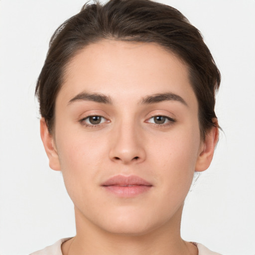 Neutral white young-adult female with short  brown hair and brown eyes