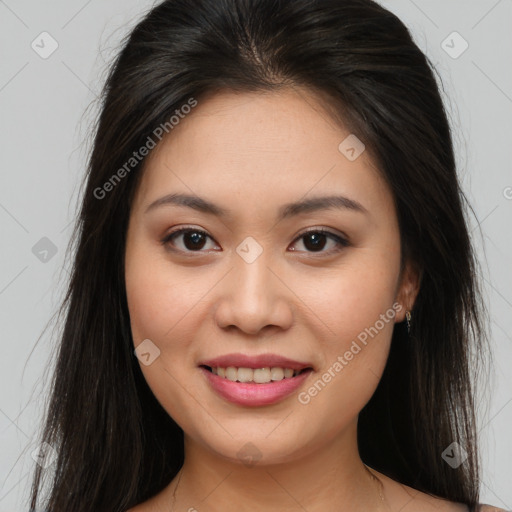 Joyful asian young-adult female with long  brown hair and brown eyes