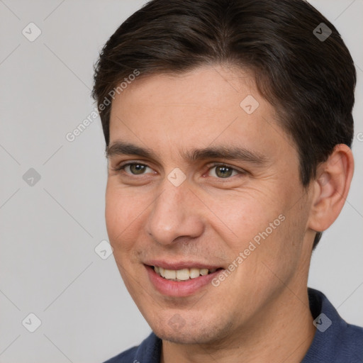 Joyful white young-adult male with short  brown hair and brown eyes