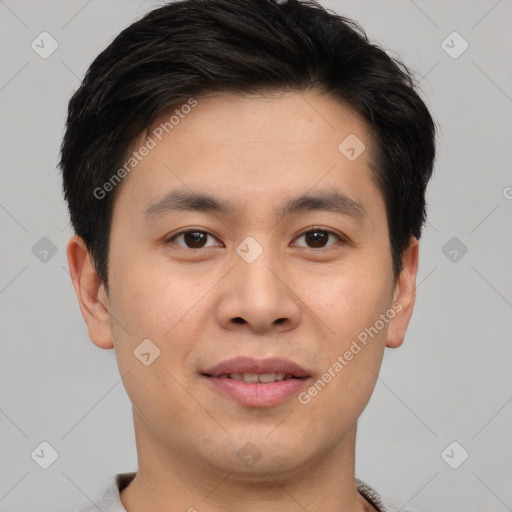 Joyful asian young-adult male with short  brown hair and brown eyes