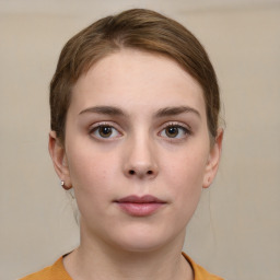 Neutral white young-adult female with short  brown hair and grey eyes