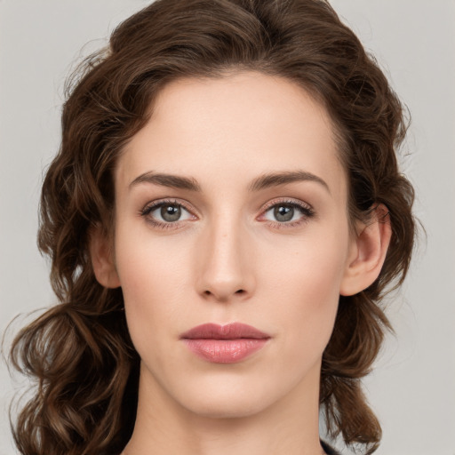 Neutral white young-adult female with medium  brown hair and green eyes