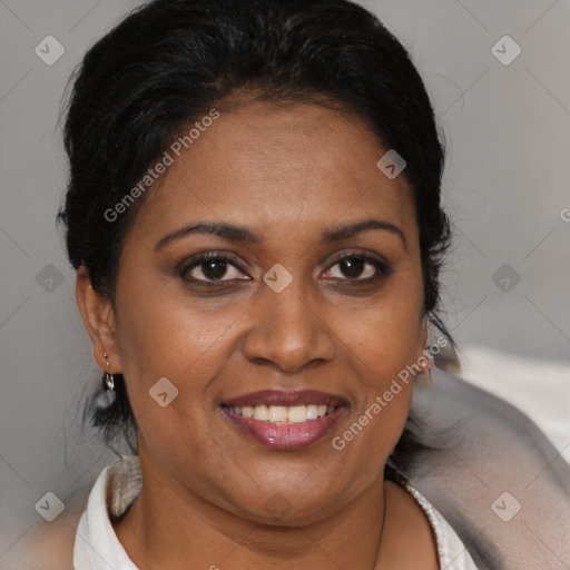 Joyful black adult female with short  brown hair and brown eyes