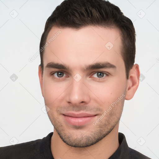 Joyful white young-adult male with short  brown hair and brown eyes