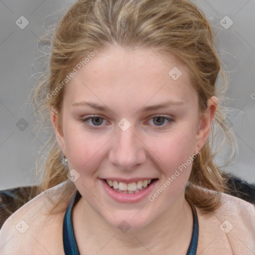 Joyful white young-adult female with medium  brown hair and blue eyes