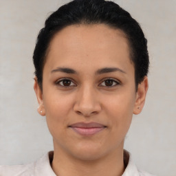 Joyful latino young-adult female with short  brown hair and brown eyes