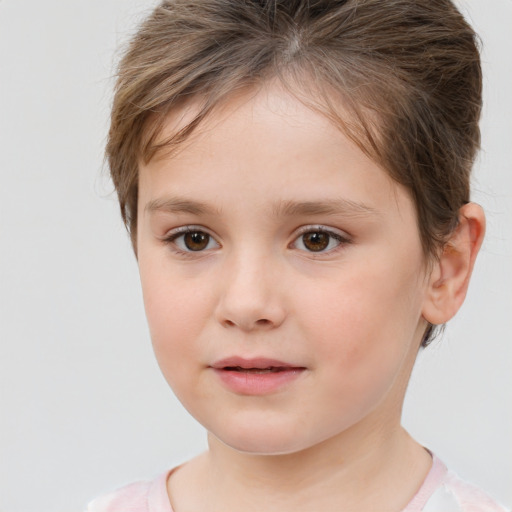 Joyful white child female with short  brown hair and brown eyes