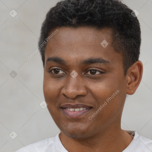 Joyful black young-adult male with short  black hair and brown eyes