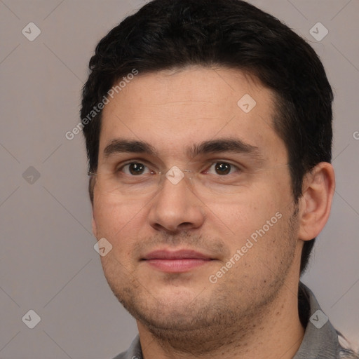 Joyful white young-adult male with short  black hair and brown eyes