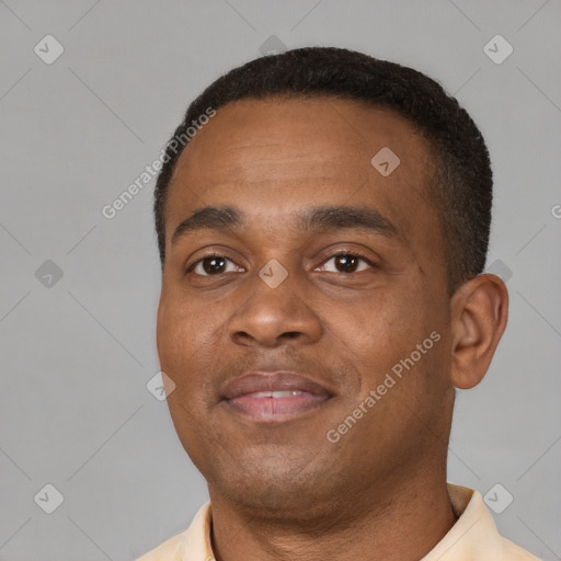 Joyful black young-adult male with short  black hair and brown eyes