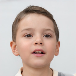 Joyful white child male with short  brown hair and brown eyes