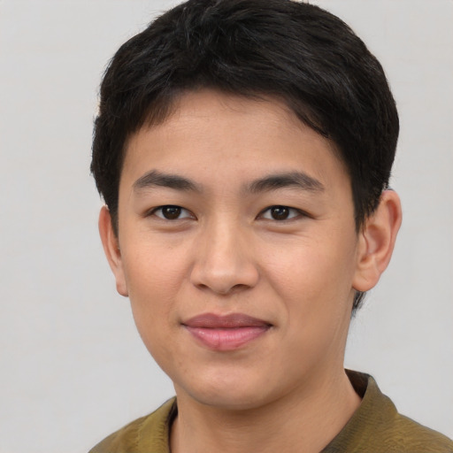 Joyful asian young-adult male with short  brown hair and brown eyes