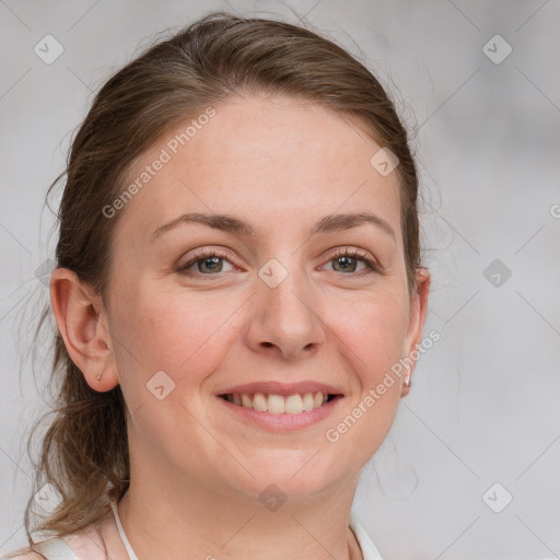 Joyful white young-adult female with medium  brown hair and blue eyes