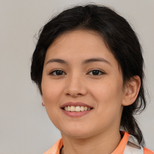 Joyful asian young-adult female with medium  brown hair and brown eyes