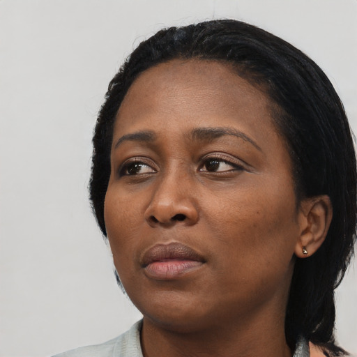 Neutral black young-adult female with medium  black hair and brown eyes