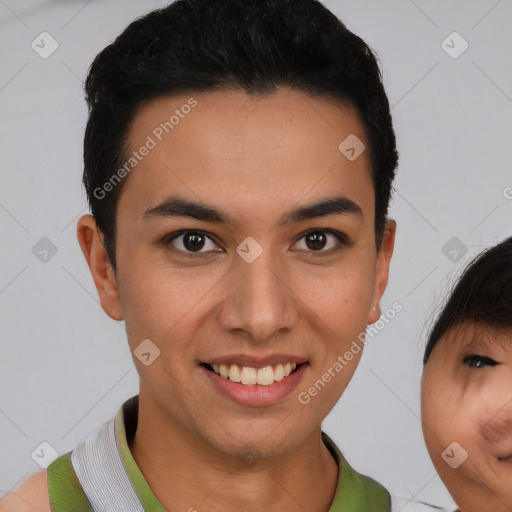 Joyful latino young-adult male with short  brown hair and brown eyes