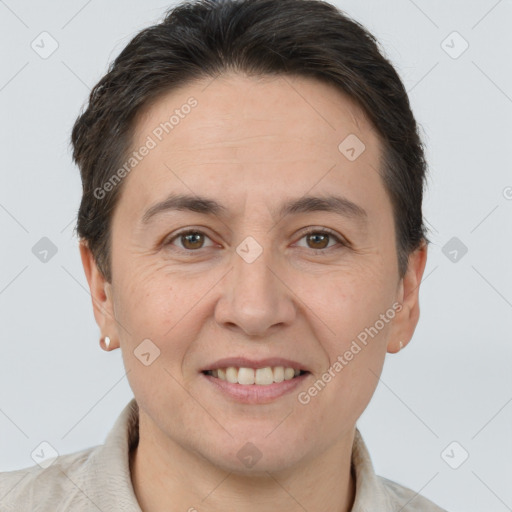 Joyful white adult female with short  brown hair and brown eyes