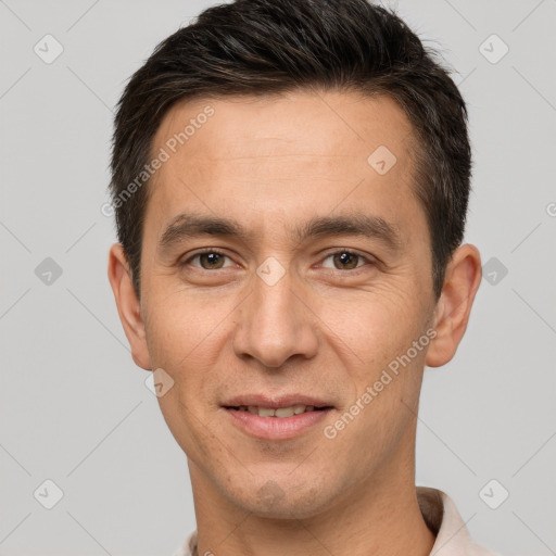 Joyful white adult male with short  brown hair and brown eyes