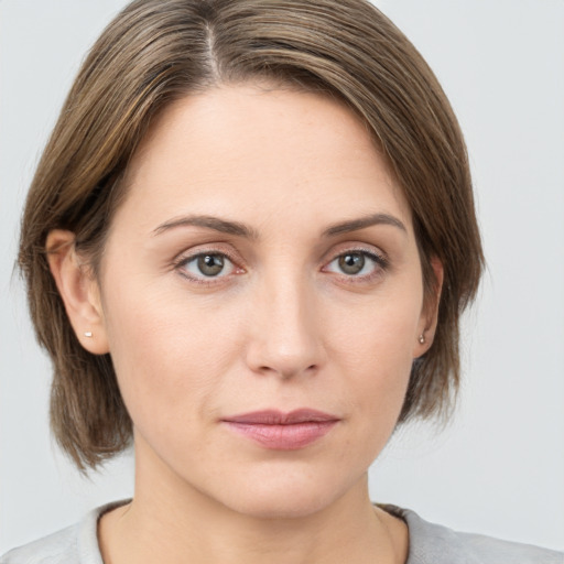 Neutral white young-adult female with medium  brown hair and grey eyes