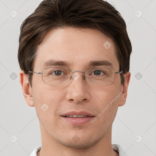 Joyful white adult male with short  brown hair and grey eyes