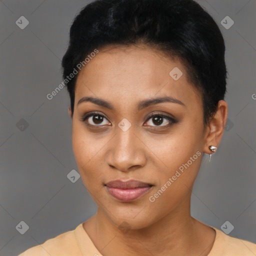 Joyful black young-adult female with short  black hair and brown eyes