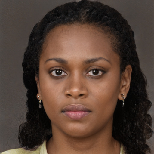 Neutral black young-adult female with long  black hair and brown eyes