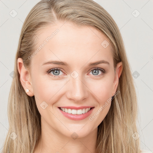 Joyful white young-adult female with long  brown hair and blue eyes