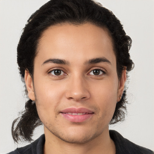 Joyful white young-adult male with medium  brown hair and brown eyes