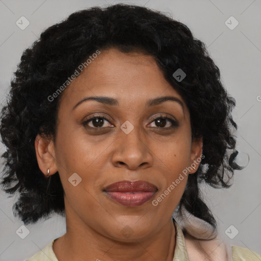 Joyful black adult female with medium  brown hair and brown eyes