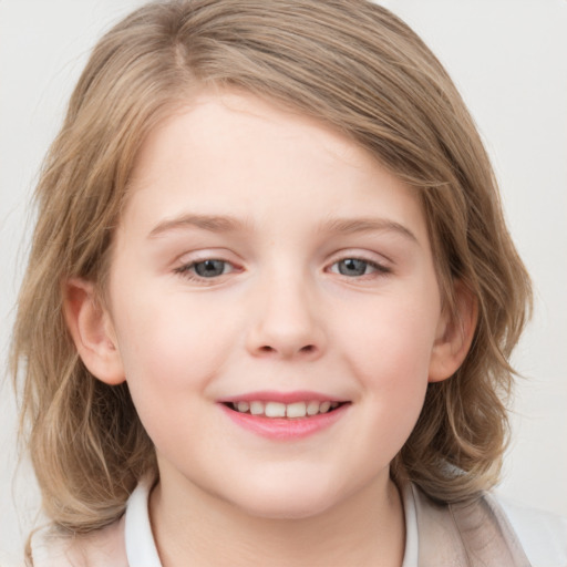 Joyful white child female with medium  brown hair and blue eyes