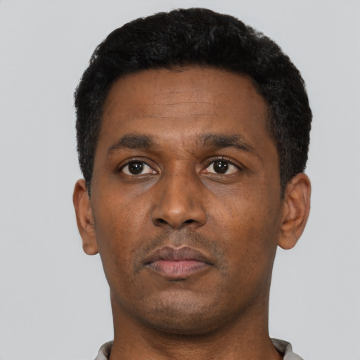 Neutral black adult male with short  black hair and brown eyes