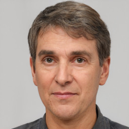 Joyful white middle-aged male with short  brown hair and brown eyes