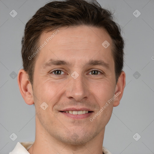 Joyful white adult male with short  brown hair and brown eyes