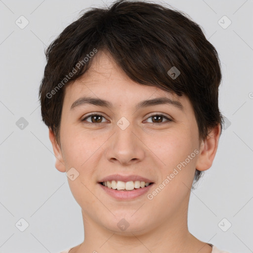 Joyful white young-adult female with short  brown hair and brown eyes