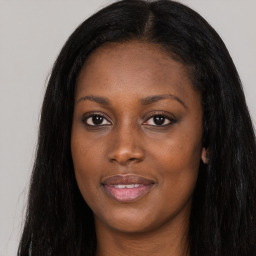 Joyful asian young-adult female with long  black hair and brown eyes