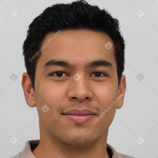 Joyful latino young-adult male with short  brown hair and brown eyes