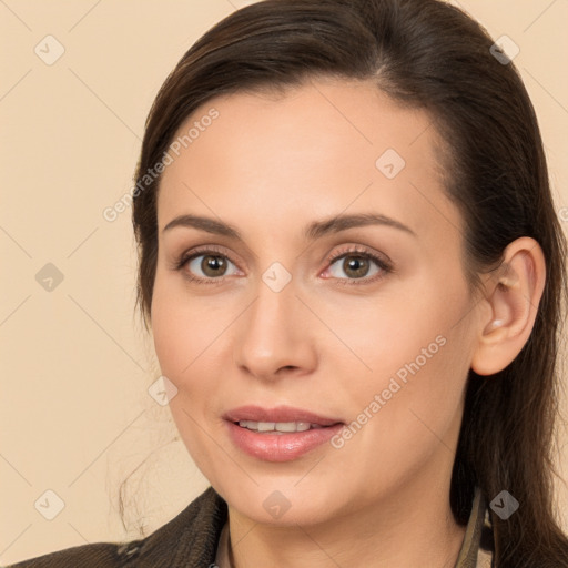 Joyful white young-adult female with long  brown hair and brown eyes