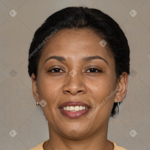 Joyful latino adult female with short  brown hair and brown eyes